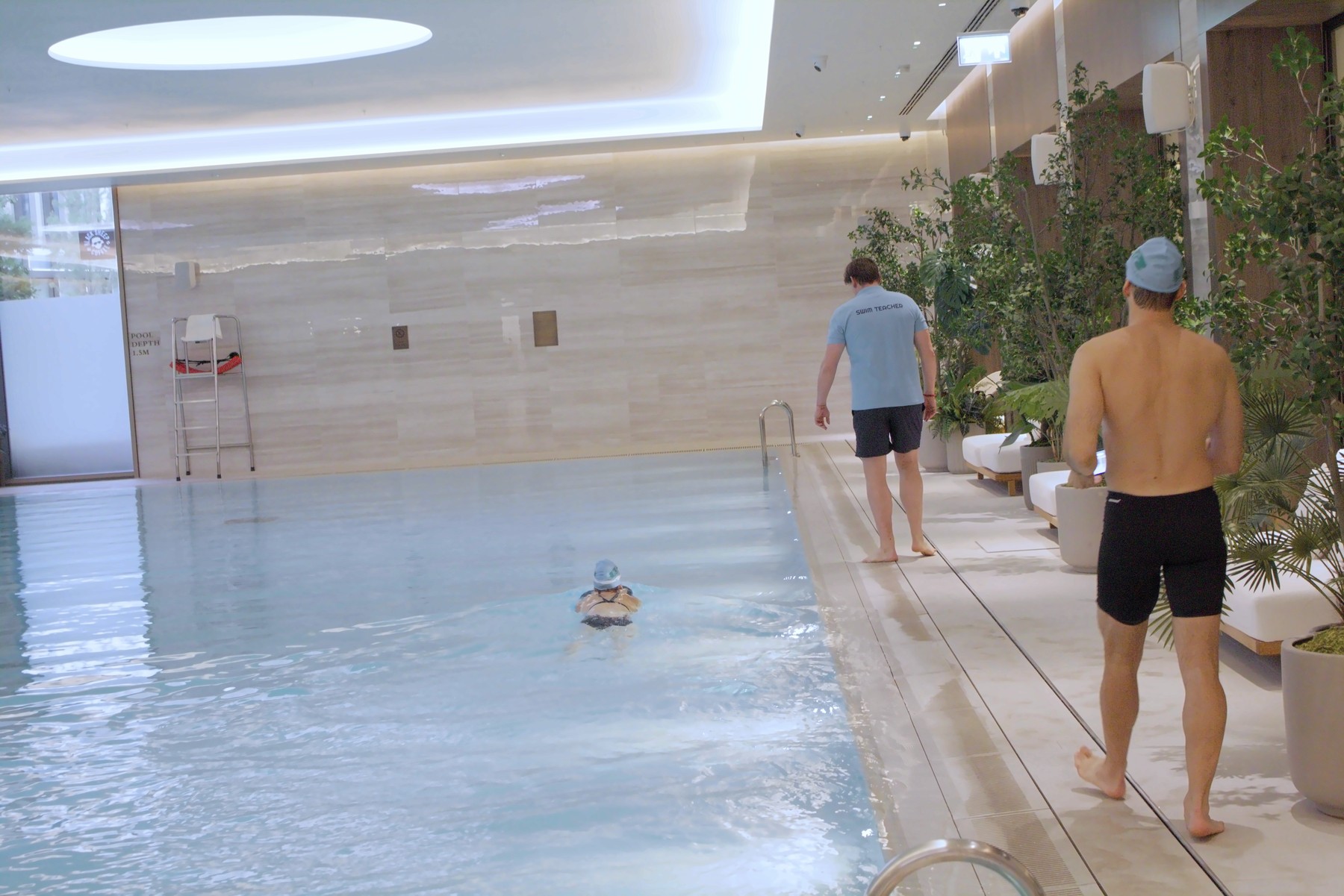 Hristo Grahovski tutoring two adult students in a private pool